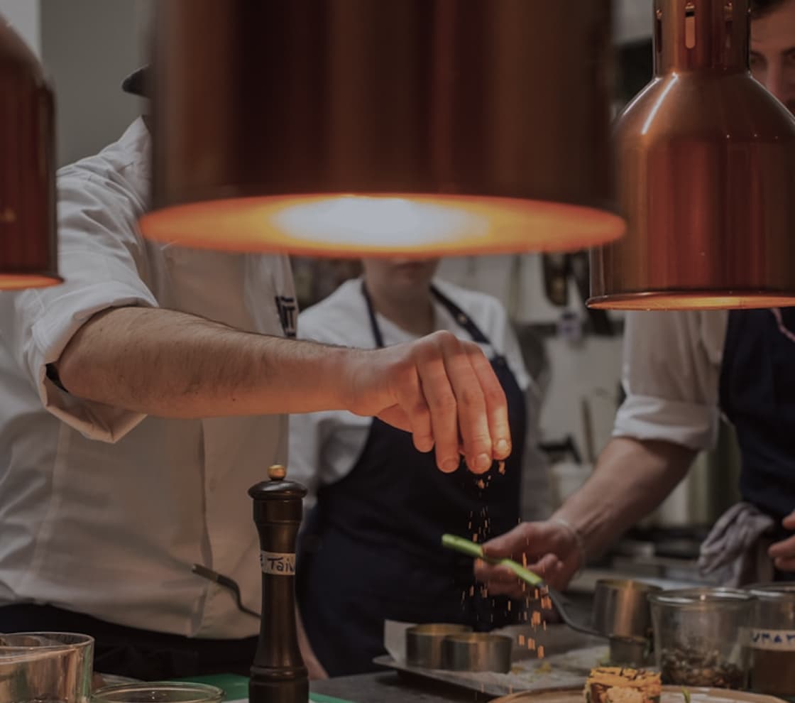 Chef preparing a dish in a professional kitchen